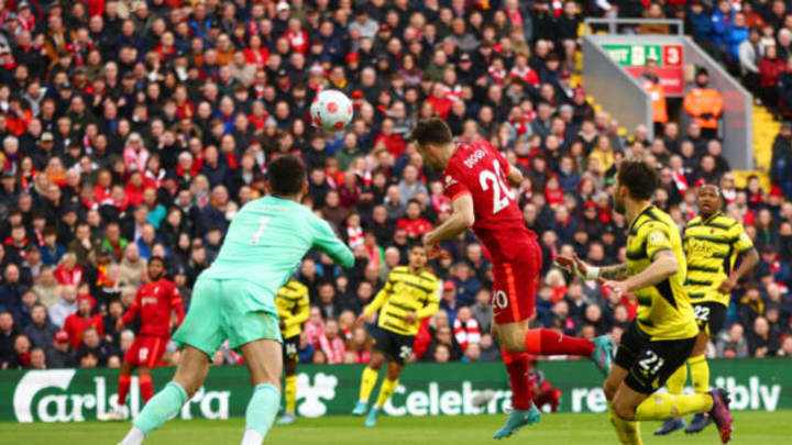 LIVERPOOL, ENGLAND – APRIL 02: Diogo Jota of Liverpool scores their team’s first goal past Kiko Femenia and Ben Foster of Watford FC during the Premier League match between Liverpool and Watford at Anfield on April 02, 2022 in Liverpool, England. (Photo by Clive Brunskill/Getty Images)