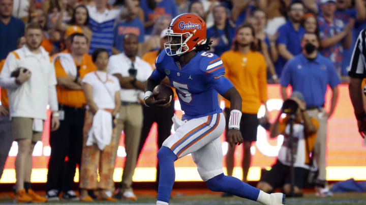 Sep 25, 2021; Gainesville, Florida, USA; Florida Gators quarterback Emory Jones (5) runs with the ball against the Tennessee Volunteers during the first quarter at Ben Hill Griffin Stadium. Mandatory Credit: Kim Klement-USA TODAY Sports