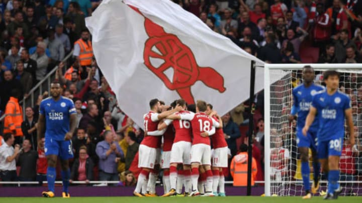 LONDON, ENGLAND – AUGUST 11: Alexandre Lacazette (obscured) of Arsenal celebrates with teammates after scoring the opening goal during the Premier League match between Arsenal and Leicester City at the Emirates Stadium on August 11, 2017 in London, England. (Photo by Shaun Botterill/Getty Images)