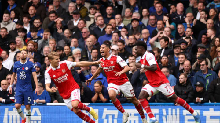 LONDON, ENGLAND - NOVEMBER 06: William Saliba celebrates with Martin Oedegaard and Bukayo Saka after Gabriel of Arsenal (not pictured) scored their sides first goal during the Premier League match between Chelsea FC and Arsenal FC at Stamford Bridge on November 06, 2022 in London, England. (Photo by Ryan Pierse/Getty Images)