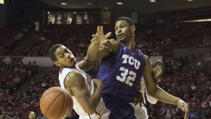 NORMAN, OK - FEBRUARY 2: Isaiah Cousins #11 of the Oklahoma Sooners knocks the ball away from Karviar Shepherd #32 of the TCU Horned Frogs during the first half of a NCAA college basketball game at the Lloyd Noble Center on February 2, 2016 in Norman, Oklahoma. (Photo by J Pat Carter/Getty Images)