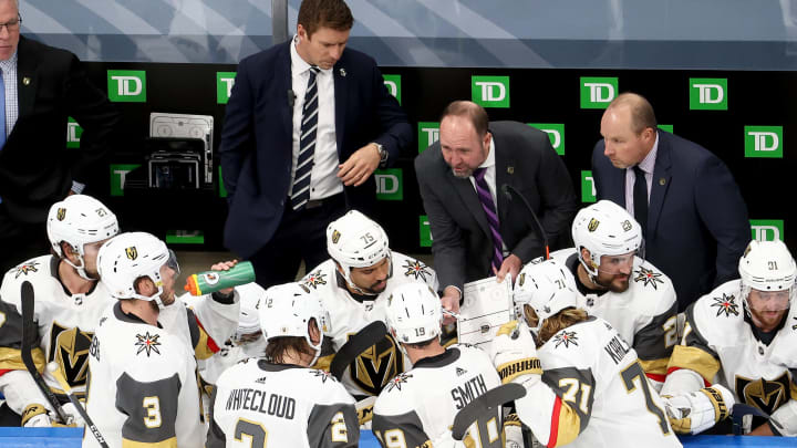 Head coach Peter DeBoer of the Vegas Golden Knights speaks to his team during a timeout against the Vancouver Canucks during the third period in Game Four
