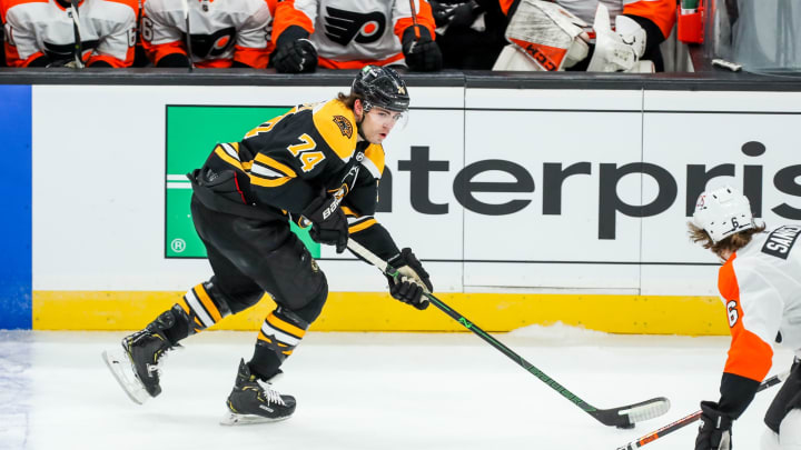 Jan 23, 2021; Boston, Massachusetts, USA; Boston Bruins left wing Jake DeBrusk (74) looks to pass during the first period against the Philadelphia Flyers at TD Garden. Mandatory Credit: Paul Rutherford-USA TODAY Sports