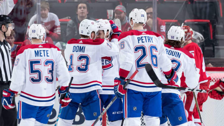 DETROIT, MI - FEBRUARY 26: Andrew Shaw #65 of the Montreal Canadiens celebrates his third goal of the game with teammates Victor Mete #53, Max Domi #13, Jeff Petry #26 and Jonathan Drouin #92 in front of goaltender Jonathan Bernier #45 of the Detroit Red Wings during the third period of an NHL game at Little Caesars Arena on February 26, 2019 in Detroit, Michigan. Montreal defeated Detroit 8-1. (Photo by Dave Reginek/NHLI via Getty Images)