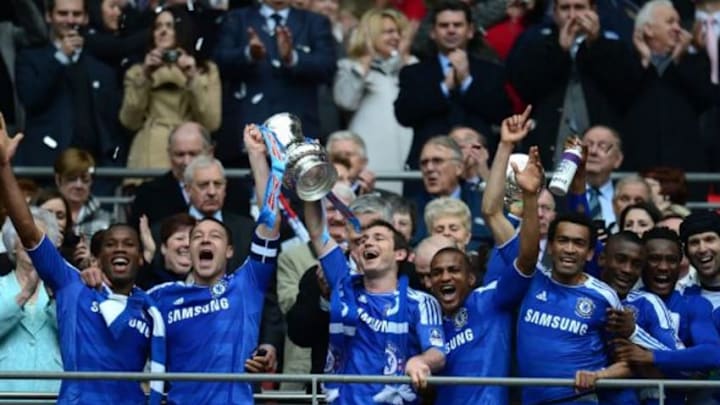 LONDON, ENGLAND - MAY 05: John Terry of Chelsea and his team mates lift the FA Cup trophy during the FA Cup with Budweiser Final match between Liverpool and Chelsea at Wembley Stadium on May 5, 2012 in London, England. (Photo by Shaun Botterill/Getty Images)