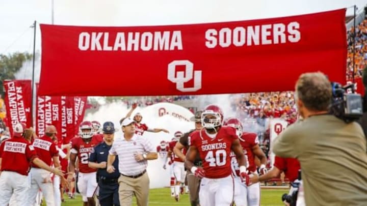 Sep 13, 2014; Norman, OK, USA; Oklahoma Sooners head coach Bob Stoops runs onto the field before the game against the Tennessee Volunteers at Gaylord Family - Oklahoma Memorial Stadium. Mandatory Credit: Kevin Jairaj-USA TODAY Sports