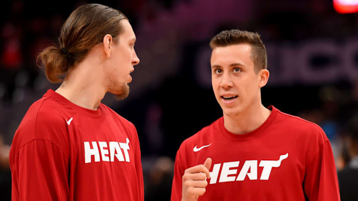 Kelly Olynyk #9 and Duncan Robinson #55 of the Miami Heat speak prior to the game against the Washington Wizards (Photo by Will Newton/Getty Images)
