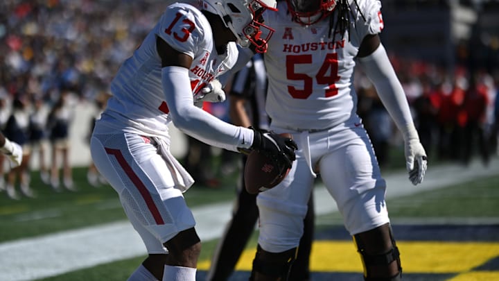 Houston Cougars quarterback Clayton Tune (3) celebrates with Houston Cougars offensive lineman Lance Robinson (54)  Mandatory Credit: Tommy Gilligan-USA TODAY Sports