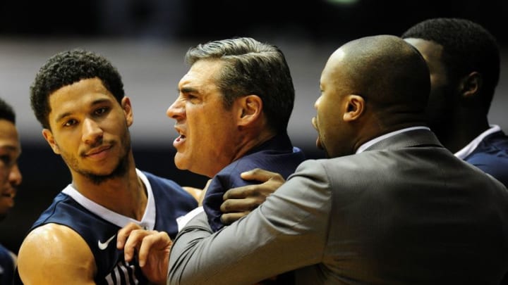 Jan 4, 2017; Indianapolis, IN, USA; Villanova head coach Jay Wright is restrained by his players and asst. coaches after receiving a Technical Foul during the first half of their game against Butler University at Hinkle Fieldhouse. Mandatory Credit: Thomas J. Russo-USA TODAY Sports