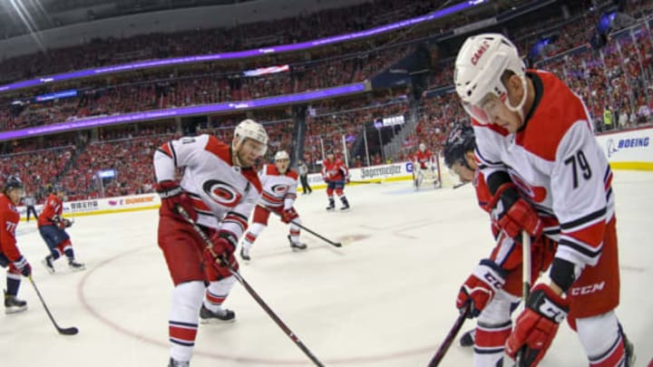 WASHINGTON, DC – APRIL 13: Carolina Hurricanes left wing Micheal Ferland (79) works the puck along the boards against Washington Capitals center Evgeny Kuznetsov (92) on April 13, 2019, at the Capital One Arena in Washington, D.C. in the first round of the Stanley Cup Playoffs. (Photo by Mark Goldman/Icon Sportswire via Getty Images)