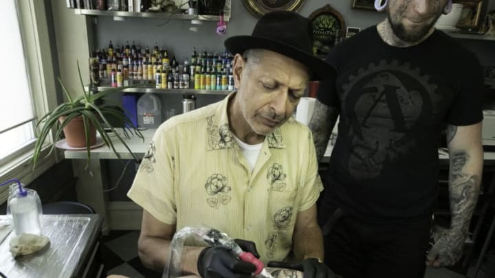 In The World According to Jeff Goldblum, Jeff meets up with passionate artists and doting fans from the tattoo community. He attends one of the largest tattoo conventions in the country, and surprises fans at a Pittsburgh tattoo parlor for "Jeff Goldblum Day." (National Geographic/George Lange)