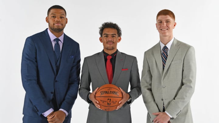 ATLANTA, GA - JUNE 25: Omari Spellman #6, Trae Young #11 and Kevin Huerter #1 of the Atlanta Hawks pose for a portrait after an introductory press conference on June 25, 2018 at Emory Healthcare Courts in Atlanta, Georgia. NOTE TO USER: User expressly acknowledges and agrees that, by downloading and/or using this Photograph, user is consenting to the terms and conditions of the Getty Images License Agreement. Mandatory Copyright Notice: Copyright 2018 NBAE (Photo by Scott Cunningham/NBAE via Getty Images)