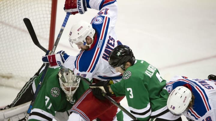 Dec 15, 2016; Dallas, TX, USA; New York Rangers center Kevin Hayes (13) tries a poke a shot by Dallas Stars goalie Antti Niemi (31) during the second period at the American Airlines Center. Mandatory Credit: Jerome Miron-USA TODAY Sports