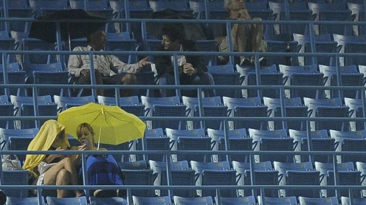 TORONTO, CANADA - SEPTEMBER 4: Fans use umbrelas after the retractable roof became stuck during MLB game action between the Baltimore Orioles and the Toronto Blue Jays September 4, 2012 at Rogers Centre in Toronto, Ontario, Canada. (Photo by Brad White/Getty Images)