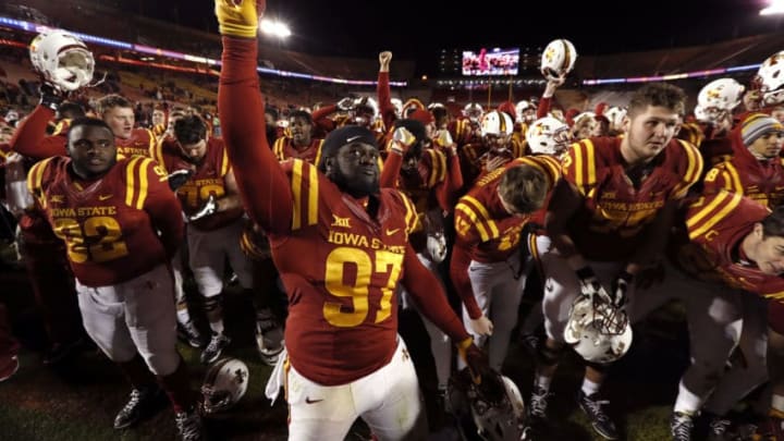 AMES, IA - NOVEMBER 19: Defensive lineman Demond Tucker #97 of the Iowa State Cyclones celebrates with his teammates after they defeated the Texas Tech Red Raiders 66-10 at Jack Trice Stadium on November 19, 2016 in Ames, Iowa. The Iowa State Cyclones won 66-10 over the Texas Tech Red Raiders. (Photo by David Purdy/Getty Images)