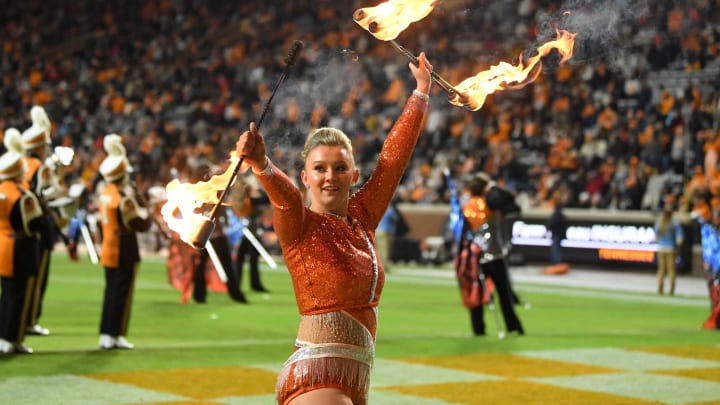 University of Tennessee Majorette Laney Puhalla twirls fire during the halftime show at the NCAA football game between the Tennessee Volunteers and South Alabama Jaguars in Knoxville, Tenn. on Saturday, November 20, 2021.Utvsal1120