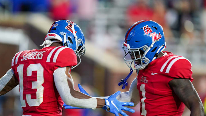 Sep 18, 2021; Oxford, Mississippi, USA; Mississippi Rebels wide receiver Braylon Sanders (13) and Mississippi Rebels wide receiver Jonathan Mingo (1) celebrate after Sanders scores a touchdown against Tulane Green Wave at Vaught-Hemingway Stadium. Mandatory Credit: Marvin Gentry-USA TODAY Sports