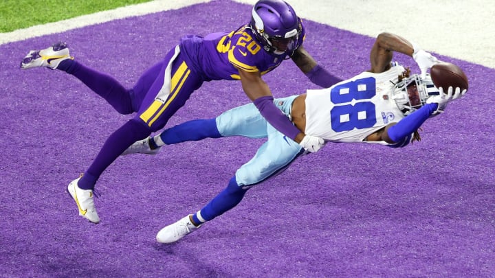 MINNEAPOLIS, MINNESOTA – NOVEMBER 22: CeeDee Lamb #88 of the Dallas Cowboys pulls in a touchdown pass against Jeff Gladney #20 of the Minnesota Vikings during their game at U.S. Bank Stadium on November 22, 2020 in Minneapolis, Minnesota. (Photo by Adam Bettcher/Getty Images)