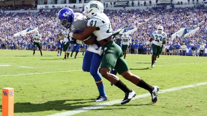 Sep 6, 2014; Lexington, KY, USA; Kentucky Wildcats wide receiver Dorian Baker (2) scores a touchdown against Ohio Bobcats cornerback Ian Wells (41) in the first half at Commonwealth Stadium. Kentucky defeated Ohio 20-3. Mandatory Credit: Mark Zerof-USA TODAY Sports