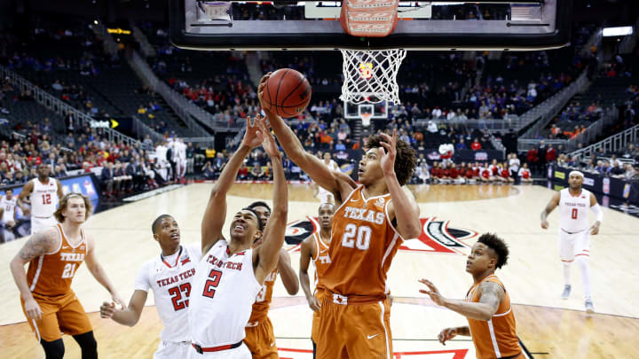 KANSAS CITY, MO – MARCH 08: Jericho Sims #20 of the Texas Longhorns and Zhaire Smith #2 of the Texas Tech Red Raiders battle for a rebound during the Big 12 Basketball Tournament quarterfinal game at the Sprint Center on March 8, 2018 in Kansas City, Missouri. (Photo by Jamie Squire/Getty Images)