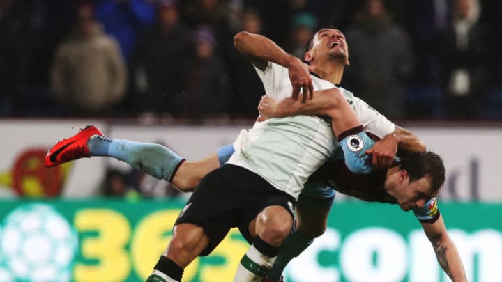 BURNLEY, ENGLAND - JANUARY 01: Dejan Lovren of Liverpool vies with Ashley Barnes of Burnley during the Premier League match between Burnley and Liverpool at Turf Moor on January 1, 2018 in Burnley, England. (Photo by Ian MacNicol/Getty Images)