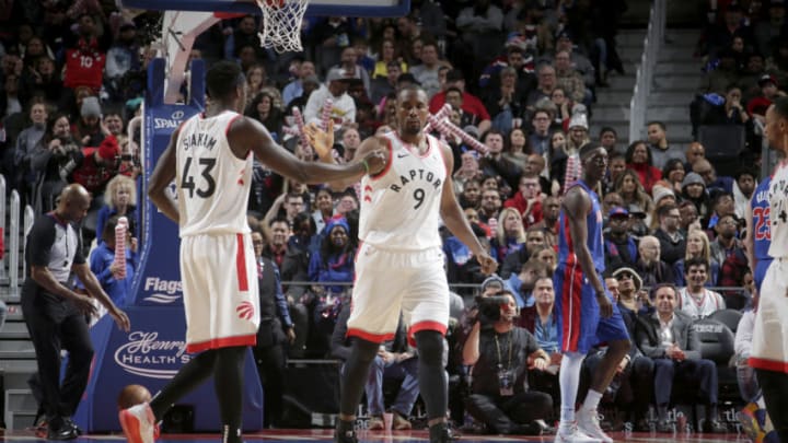 DETROIT, MI - DECEMBER 18: Pascal Siakam #43, and Serge Ibaka #9 of the Toronto Raptors hi-five each other against the Detroit Pistons on December 18, 2019 at Little Caesars Arena in Detroit, Michigan. NOTE TO USER: User expressly acknowledges and agrees that, by downloading and/or using this photograph, User is consenting to the terms and conditions of the Getty Images License Agreement. Mandatory Copyright Notice: Copyright 2019 NBAE (Photo by Brian Sevald/NBAE via Getty Images)