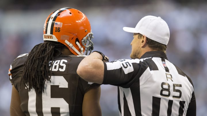 ARLINGTON, TX – NOVEMBER 18: Referee Ed Hochuli and Joshua Cribbs #16 of the Cleveland Browns talk during a game against the Dallas Cowboys at Cowboys Stadium on November 18, 2012 in Arlington, Texas. The Cowboys defeated the Browns 23-20. (Photo by Wesley Hitt/Getty Images)