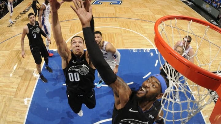 ORLANDO, FL - NOVEMBER 14: Aaron Gordon #00 of the Orlando Magic rebounds the ball against the Philadelphia 76ers on November 14, 2018 at Amway Center in Orlando, Florida. NOTE TO USER: User expressly acknowledges and agrees that, by downloading and/or using this photograph, user is consenting to the terms and conditions of the Getty Images License Agreement. Mandatory Copyright Notice: Copyright 2018 NBAE (Photo by Fernando Medina/NBAE via Getty Images)