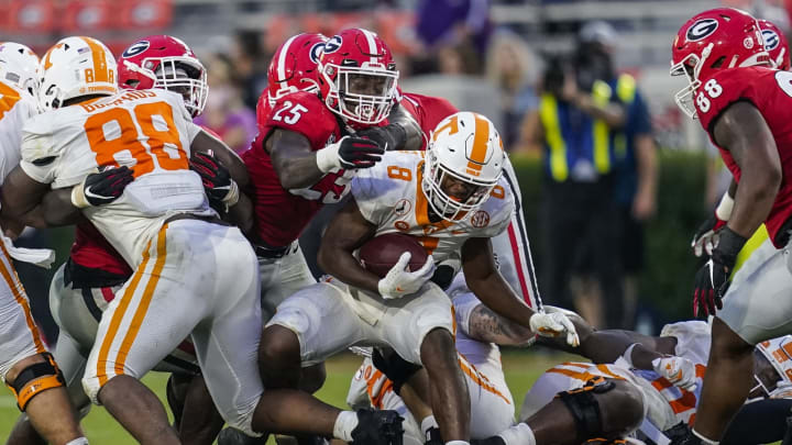 Oct 10, 2020; Athens, Georgia, USA; Georgia Bulldogs linebacker Quay Walker (25) with help from defensive lineman Jalen Carter (88) tackles Tennessee Volunteers running back Ty Chandler (8) during the second half at Sanford Stadium. Mandatory Credit: Dale Zanine-USA TODAY Sports