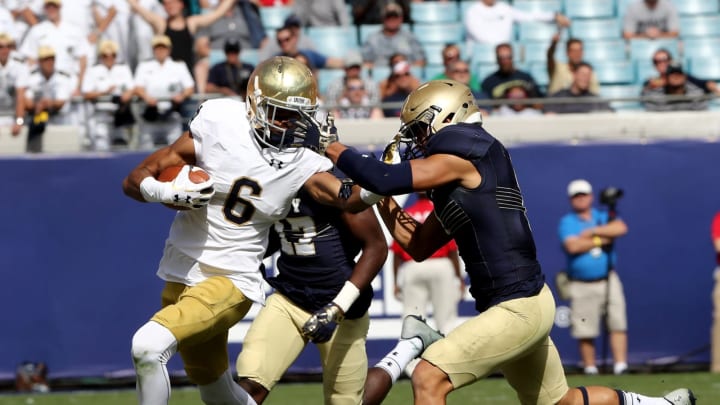 JACKSONVILLE, FL – NOVEMBER 05: Alohi Gilman #1 of the Navy Midshipmen attempts to tackle Equanimeous St. Brown #6 of the Notre Dame Fighting Irish during the game at EverBank Field on November 5, 2016 in Jacksonville, Florida. (Photo by Sam Greenwood/Getty Images)