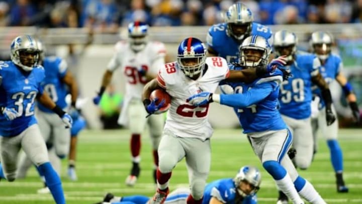Dec 22, 2013; Detroit, MI, USA; New York Giants running back Michael Cox (29) returns a kick off during the overtime quarter against the Detroit Lions at Ford Field. Mandatory Credit: Andrew Weber-USA TODAY Sports