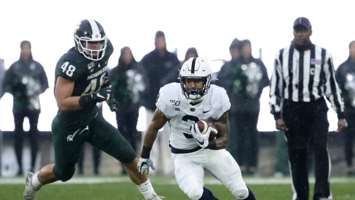 EAST LANSING, MI – OCTOBER 26: Running back Ricky Slade #3 of the Penn State Nittany Lions is pursued by defensive end Kenny Willekes #48 of the Michigan State Spartans during the first half at Spartan Stadium on October 26, 2019 in East Lansing, Michigan. (Photo by Duane Burleson/Getty Images)