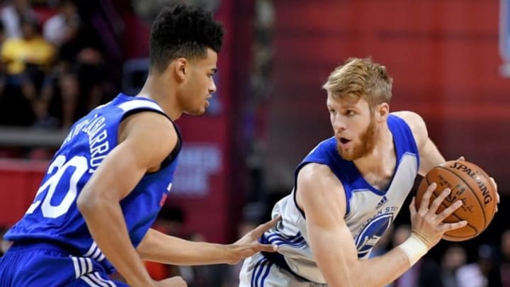 Jul 12, 2016; Las Vegas, NV, USA; Golden State Warriors guard Thomas Walkup (10) protects the ball from Philadelphia 76ers guard Timothe Luwawu-Cabarrot (20) during an NBA Summer League game at Thomas & Mack Center. Mandatory Credit: Stephen R. Sylvanie-USA TODAY Sports