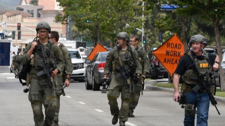 June 1, 2016; Los Angeles, CA, USA; Law enforcement personnel walk down Westwood Blvd. from the UCLA campus after a shooting was reported this morning. The campus was on lockdown throughout the morning. Two people have been reported dead. Mandatory Credit: Robert Hanashiro-USA TODAY NETWORK