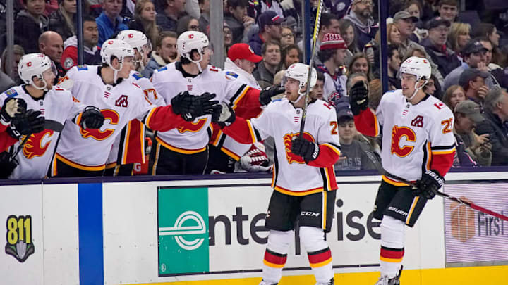 COLUMBUS, OH - DECEMBER 4: Sean Monahan #23 of the Calgary Flames is congratulated by his teammates after scoring a goal during the second period of the game against the Columbus Blue Jackets on December 4, 2018 at Nationwide Arena in Columbus, Ohio. (Photo by Kirk Irwin/Getty Images)