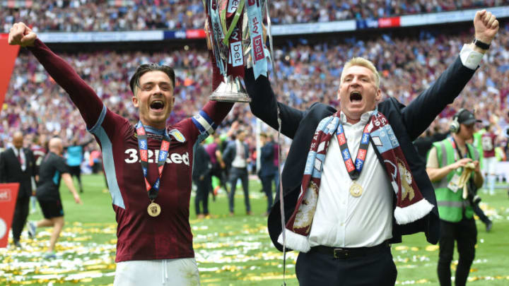 LONDON, ENGLAND – MAY 27: Jack Grealish of Aston Villa and Dean Smith, Manager of Aston Villa celebrate with the Sky Bet Championship Play-off Final Trophy following their team’s victory in the Sky Bet Championship Play-off Final match between Aston Villa and Derby County at Wembley Stadium on May 27, 2019 in London, United Kingdom. (Photo by Harriet Lander/Copa/Getty Images)
