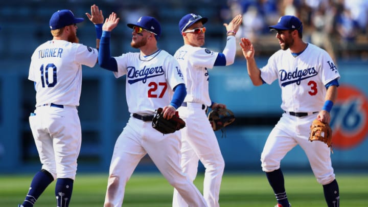 LOS ANGELES, CALIFORNIA - MARCH 31: Justin Turner #10, Alex Verdugo #27, Kike Hernandez #14 and Max Muncy #3 of the Los Angeles Dodgers celebrate their 8-7 victory against the Arizona Diamondbacks at Dodger Stadium on March 31, 2019 in Los Angeles, California. (Photo by Yong Teck Lim/Getty Images)