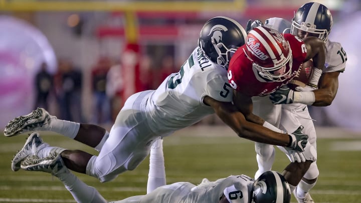 BLOOMINGTON, IN – SEPTEMBER 22: Whop Philyor #22 of the Indiana Hoosiers is tackled while rushing by Andrew Dowell #5 and Josh Butler #19 of the Michigan State Spartans during the game at Memorial Stadium on September 22, 2018 in Bloomington, Indiana. (Photo by Michael Hickey/Getty Images)