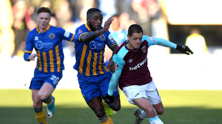 SHREWSBURY, ENGLAND - JANUARY 07: Abumere Ogogo of Shrewsbury Town and Javier Hernandez of West Ham United battle for the ball during The Emirates FA Cup Third Round match between Shrewsbury Town and West Ham United at Montgomery Waters Meadow on January 7, 2018 in Shrewsbury, England. (Photo by Gareth Copley/Getty Images)