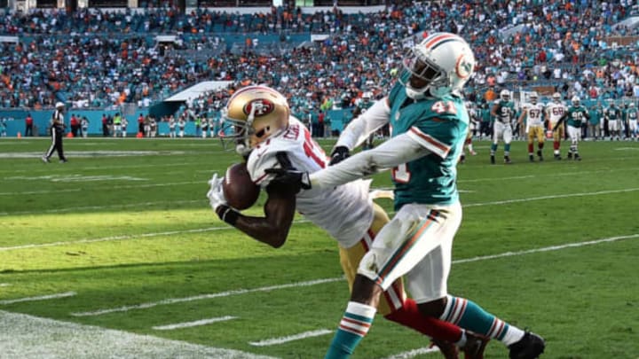 Nov 27, 2016; Miami Gardens, FL, USA; San Francisco 49ers wide receiver Jeremy Kerley (17) makes a catch in front of Miami Dolphins cornerback Byron Maxwell (41) during the second half at Hard Rock Stadium. The Dolphins won 31-24. Mandatory Credit: Steve Mitchell-USA TODAY Sports