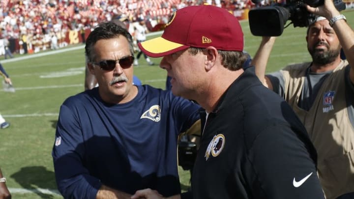 Sep 20, 2015; Landover, MD, USA; St. Louis Rams head coach Jeff Fisher (L) shakes hands with Washington Redskins head coach Jay Gruden (R) after their game at FedEx Field. The Redskins won 24-10. Mandatory Credit: Geoff Burke-USA TODAY Sports