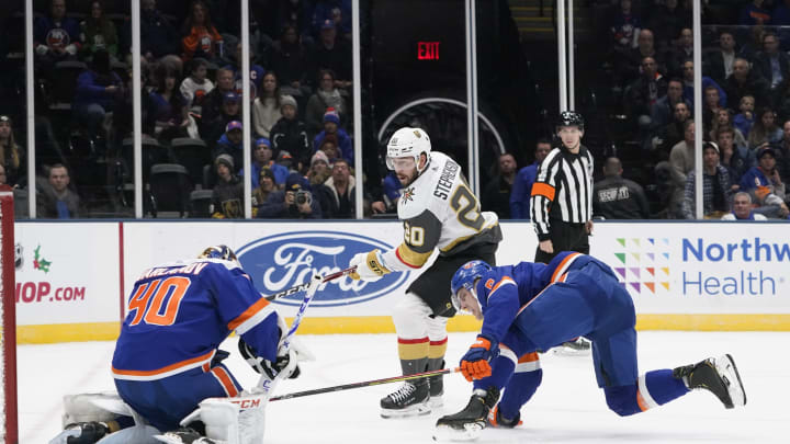UNIONDALE, NY – DECEMBER 05: Vegas Golden Knights Center Chandler Stephenson (20) takes a shot on goal with New York Islanders Goalie Semyon Varlamov (40) making the save during the first period of the National Hockey League game between the Las Vegas Golden Knights and the New York Islanders on December 5, 2019, at the Nassau Veterans Memorial Coliseum in Uniondale, NY. (Photo by Gregory Fisher/Icon Sportswire via Getty Images)