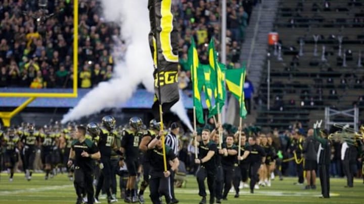 Nov 1, 2014; Eugene, OR, USA; Oregon Ducks cheerleaders run on to the field before the start of the game against the Stanford Cardinal at Autzen Stadium. Mandatory Credit: Scott Olmos-USA TODAY Sports