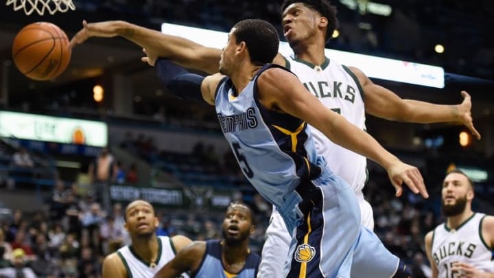 Mar 17, 2016; Milwaukee, WI, USA; Milwaukee Bucks forward Damien Inglis (17) blocks a shot by Memphis Grizzlies guard Ray McCallum (5) in the second quarter at BMO Harris Bradley Center. Mandatory Credit: Benny Sieu-USA TODAY Sports