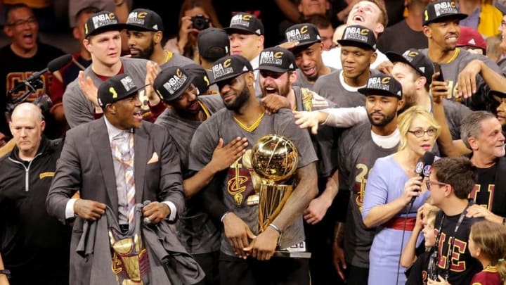 Jun 19, 2016; Oakland, CA, USA; Cleveland Cavaliers forward LeBron James (23) celebrates with the Larry O'Brien Championship Trophy after beating the Golden State Warriors in game seven of the NBA Finals at Oracle Arena. Mandatory Credit: Kelley L Cox-USA TODAY Sports