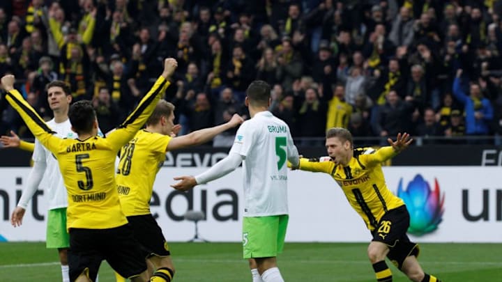 DORTMUND, GERMANY - FEBRUARY 18: Players of Borussia Dortmund celebrate after scoring a goal during the Bundesliga soccer match between Borussia Dortmund and VfL Wolfsburg at the Signal Iduna Park in Dortmund, Germany on February 18, 2017. (Photo by Leon Kuegeler/Anadolu Agency/Getty Images)