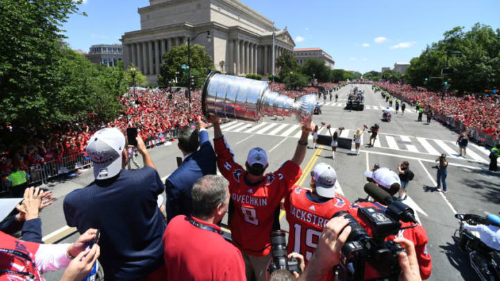 WASHINGTON, DC - JUNE 12: Washington Capitals left wing Alex Ovechkin (8) hoists the cup during the Parade for the Stanley Cup Champion Washington Capitals. (Photo by Jonathan Newton/The Washington Post via Getty Images)