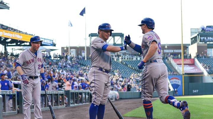 DENVER, CO - JUNE 18: Brandon Nimmo #9 of the New York Mets celebrates with Asdrubal Cabrera #13 and Todd Frazier #21 after scoring on a first inning inside-the-park homerun against the Colorado Rockies at Coors Field on June 18, 2018 in Denver, Colorado. (Photo by Dustin Bradford/Getty Images)