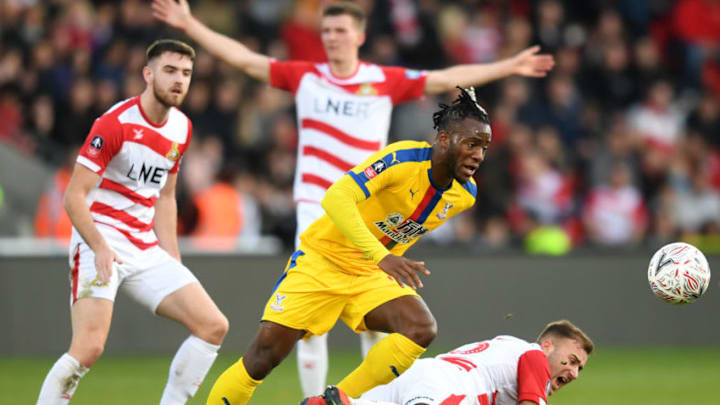 DONCASTER, ENGLAND - FEBRUARY 17: Michy Batshuayi of Crystal Palace battles with Herbie Kane of Doncaster Rovers during the FA Cup Fifth Round match between Doncaster Rovers and Crystal Palace at Keepmoat Stadium on February 17, 2019 in Doncaster, United Kingdom. (Photo by Michael Regan/Getty Images)