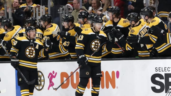 BOSTON, MA - DECEMBER 23: Boston Bruins center Charlie Coyle (13) skates by the bench after scoring his 100th NHL goal shorthanded during a game between the Boston Bruins and the Washington Capitals on December 23, 2019 at TD Garden in Boston, Massachusetts. (Photo by Fred Kfoury III/Icon Sportswire via Getty Images)